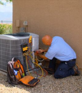 HVAC technician Myle doing an emergency air conditioning repair in a home in Tucson