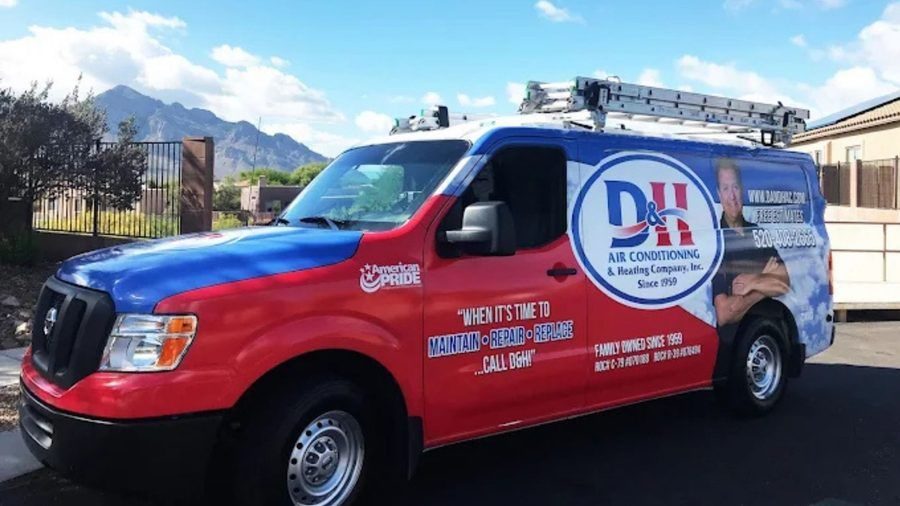 D&H van sitting in residential driveaway during plumbing service.